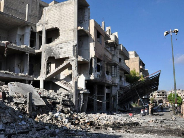 a handout picture released by the official syrian arab news agency sana on september 5 2016 reportedly shows syrian army soldiers inspecting the damage at the site of a suspected car bombing in a government held area in the city of homs photo afp a handout picture released by the official syrian arab news agency sana on september 5 2016 reportedly shows syrian army soldiers inspecting the damage at the site of a suspected car bombing in a government held area in the city of homs photo afp