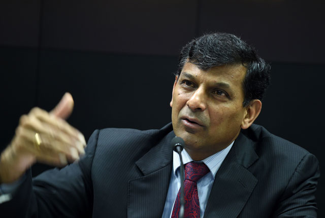 in this file photograph taken on august 9 2016 governor of the reserve bank of india rbi raghuram rajan gestures as he addresses media representatives at a press conference in mumbai photo afp