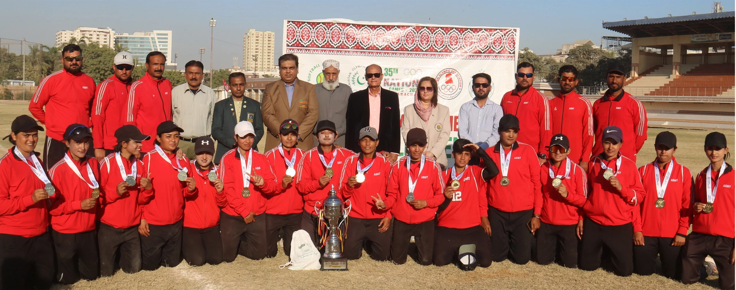 pakistan army women s softball team posing with the trophy