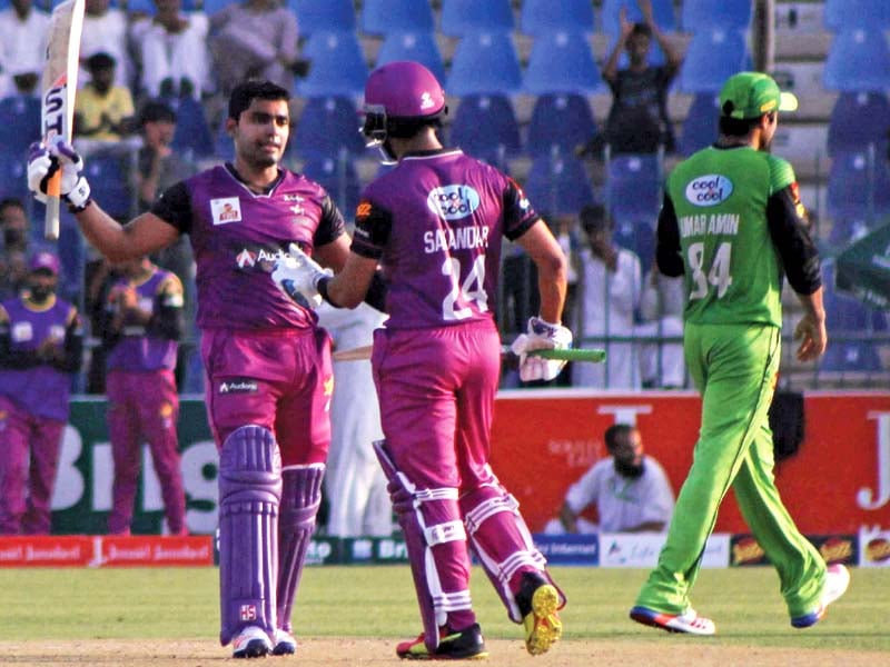 umar akmal celebrates his record equalling century after pummelling rawalpindi bowlers for nine sixes and as many fours photo shahid saeed express