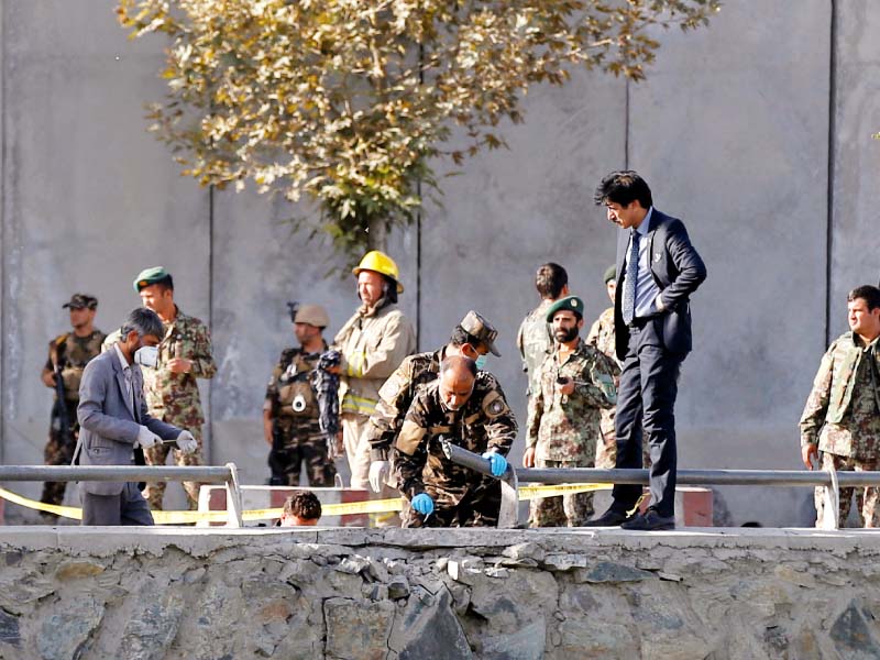 afghan security forces inspect the site of a suicide attack in kabul photo reuters