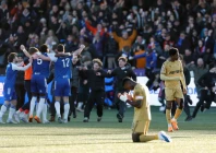 crystal palace s marc guehi looks dejected as macclesfield f c players celebrate after the match photo reuters