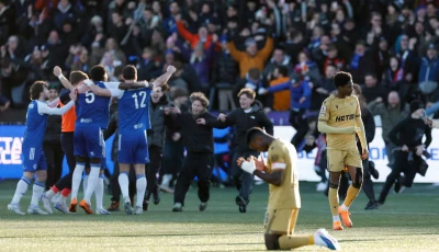 crystal palace s marc guehi looks dejected as macclesfield f c players celebrate after the match photo reuters