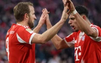 kane helps bayern extend bundesliga lead