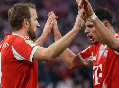 kane helps bayern extend bundesliga lead