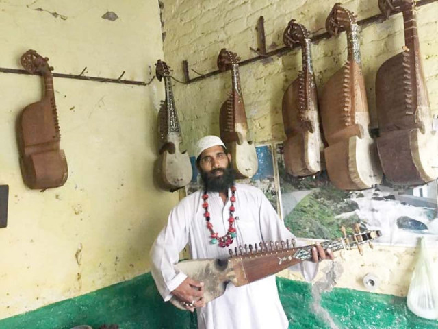 malang ustaad seen playing rabab at his shop in sardheri photo express