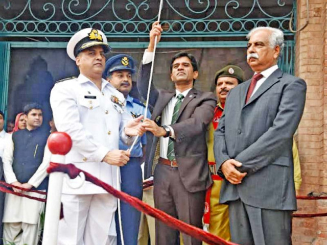 the dco hoists hilal i istaqlal awarded to the citizens of lahore for their role in the 1965 war photo abid nawaz express the dco hoists hilal i istaqlal awarded to the citizens of lahore for their role in the 1965 war photo abid nawaz express