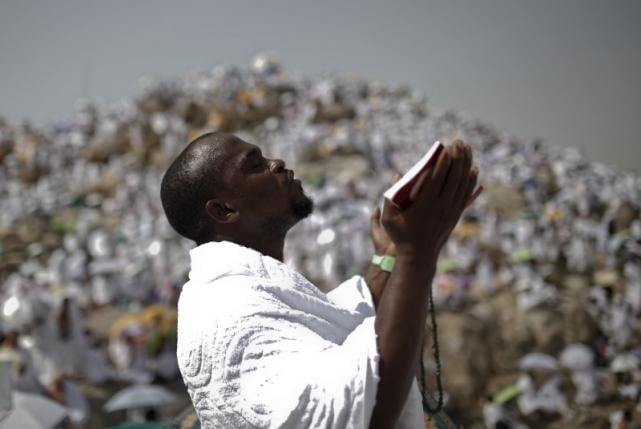 a muslim pilgrim prays on mount mercy on the plains of arafat during the annual haj pilgrimage outside the holy city of makkah september 23 2015 photo reuters