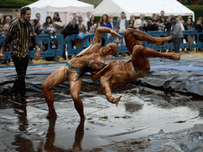 competitors slip and slide for gravy wrestling championships