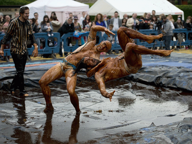 wrestlers wearing fancy dress tackled a slippery surface for a somewhat unusual contest photo afp wrestlers wearing fancy dress tackled a slippery surface for a somewhat unusual contest photo afp