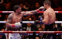 usyk survives scare to stop verhoeven