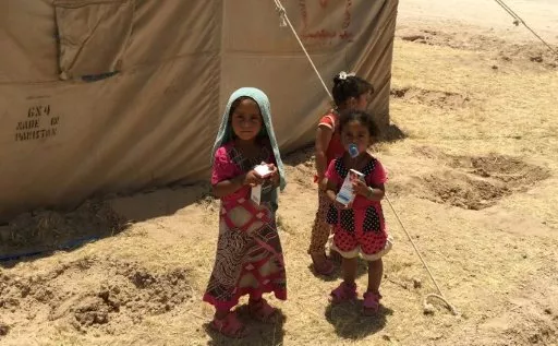 displaced iraqi children stand outside a tent at a camp southwest of baghdad in may 2016 photo afp displaced iraqi children stand outside a tent at a camp southwest of baghdad in may 2016 photo afp