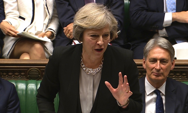 british prime minister theresa may speaks at the dispatch box with british chancellor of the exchequer philip hammond r listening on the front bench during prime ministers questions in the house of commons in central london on september 7 2016 photo afp