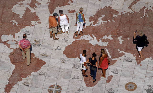 people walk over a world map engraved in marble in lisbon september 14 2011 photo reuters people walk over a world map engraved in marble in lisbon september 14 2011 photo reuters