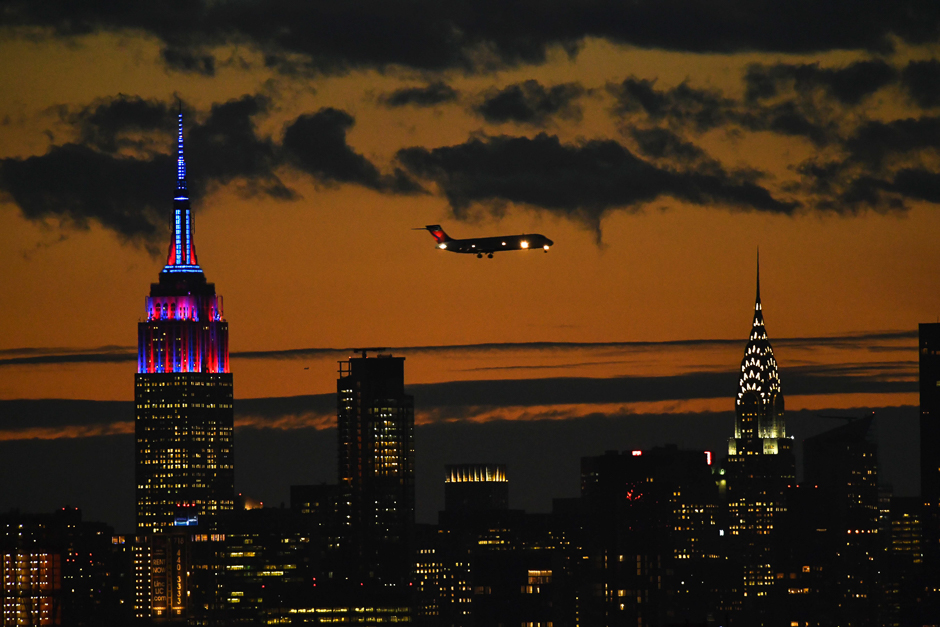 the empire state building is lit in colors of the fc barcelona football club as seen from the usta billie jean king national tennis center in new york in honor of fc barcelona 039 s 10 year global partnership with unicef photo afp