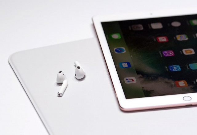 a pair of wireless airpods are seen during a media event photo afp a pair of wireless airpods are seen during a media event photo afp