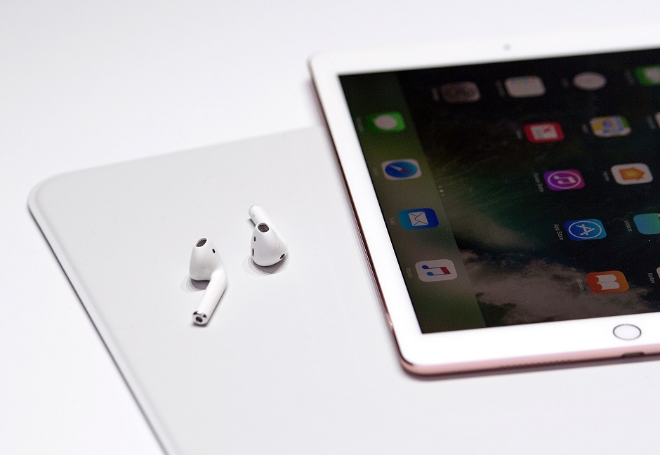 a pair of wireless airpods are seen during a media event photo afp