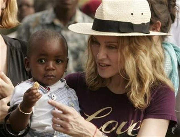 madonna holds her adopted son david banda at an orphan care centre run by raising malawi a grassroots initiative by madonna in mphendula village photo reuters madonna holds her adopted son david banda at an orphan care centre run by raising malawi a grassroots initiative by madonna in mphendula village photo reuters