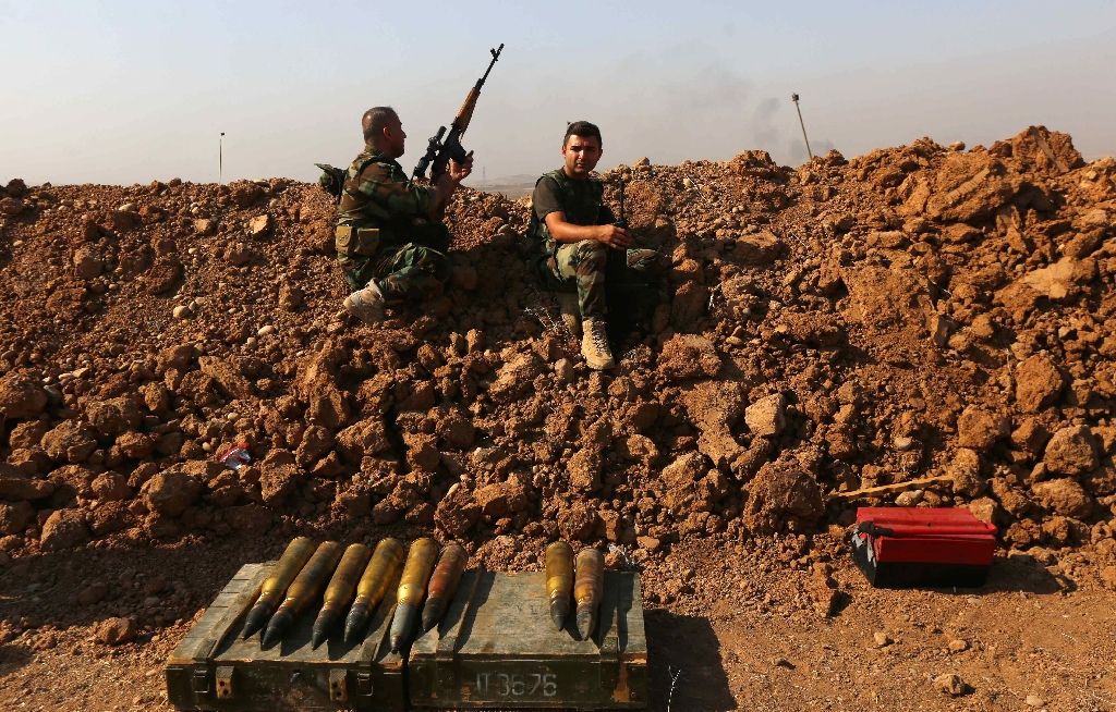 iraqi kurdish peshmerga fighters hold a position on the front line near hasan sham village some 45 kilometres east of the city of mosul during an operation aimed at retaking areas from the islamic state group photo afp