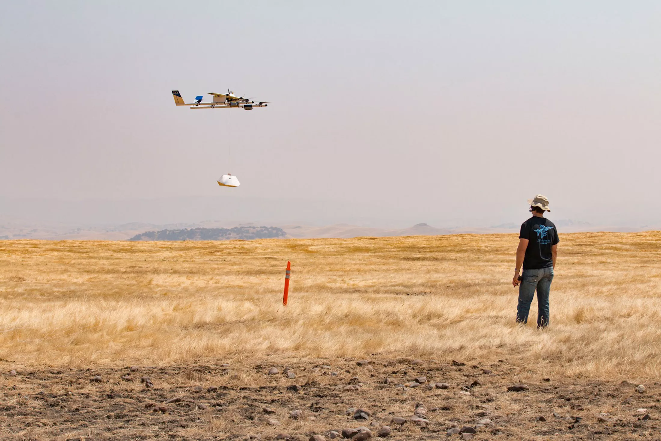 a project wing aircraft lowering a package to the ground during recent testing photo alphabet inc a project wing aircraft lowering a package to the ground during recent testing photo alphabet inc