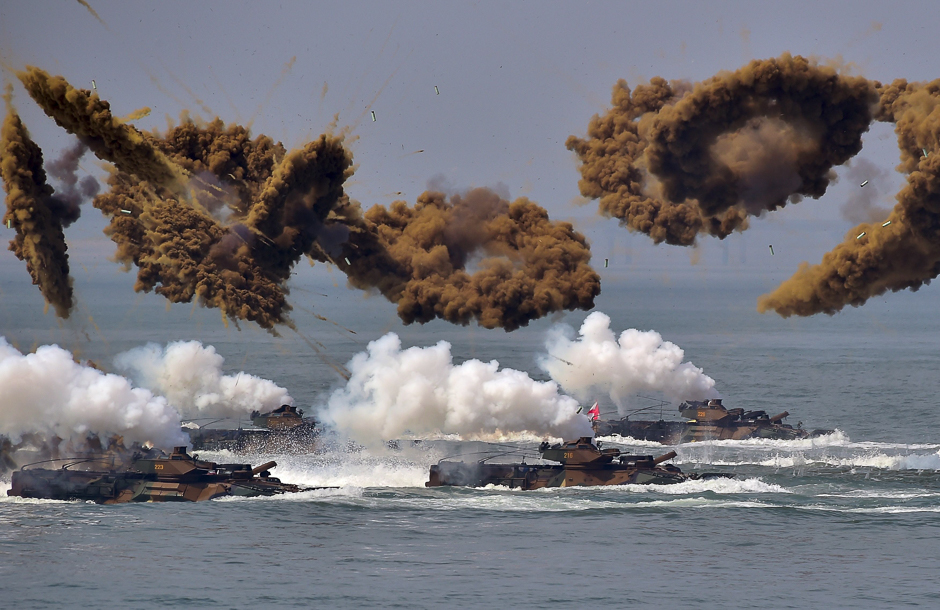 south korean amphibious vehicles fire smoke shells during a re enactment of the incheon landing to mark the 66th anniversary of the start of operation chromite the battle that turned the tide in the korean war in the western port city of incheon photo afp