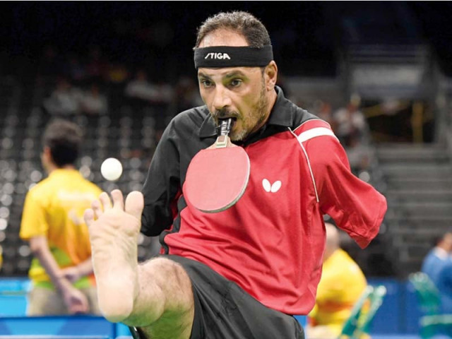 hamadtou uses his strong neck to transform his head into the equivalent of an arm and his mouth into a hand photo afp hamadtou uses his strong neck to transform his head into the equivalent of an arm and his mouth into a hand photo afp