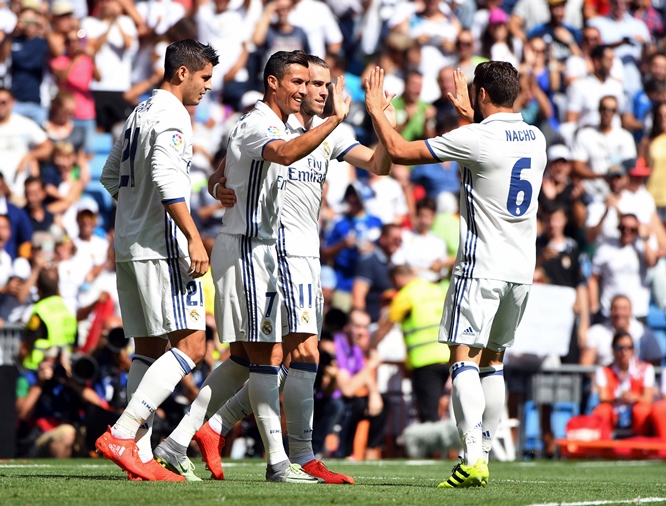 real madrid 039 s portuguese forward cristiano ronaldo c celebrates with teammates after scoring during the spanish league football match real madrid cf vs ca osasuna at the santiago bernabeu stadium in madrid on september 10 2016 photo afp