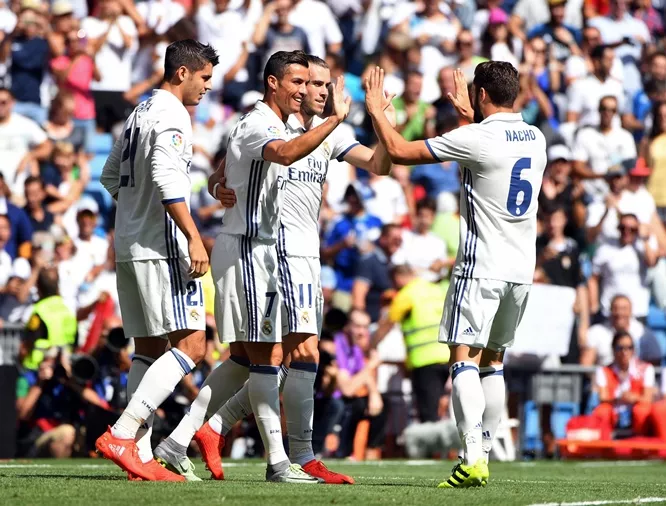 real madrid 039 s portuguese forward cristiano ronaldo c celebrates with teammates after scoring during the spanish league football match real madrid cf vs ca osasuna at the santiago bernabeu stadium in madrid on september 10 2016 photo afp real madrid 039 s portuguese forward cristiano ronaldo c celebrates with teammates after scoring during the spanish league football match real madrid cf vs ca osasuna at the santiago bernabeu stadium in madrid on september 10 2016 photo afp