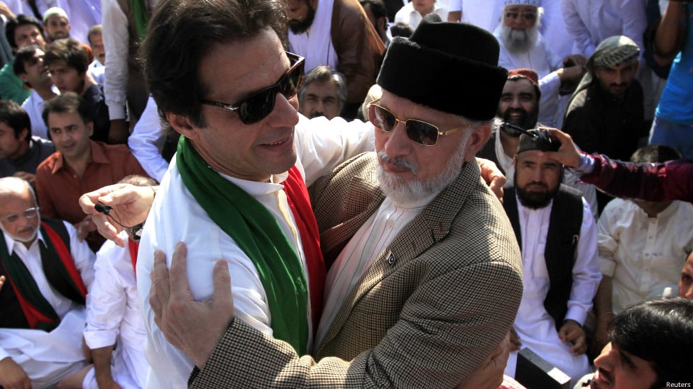 in this file photo pti chairman imran khan embraces pat chief tahirul qadri photo reuters