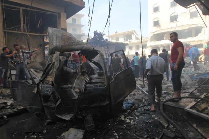 residents inspect a damaged site after airstrikes on a market in the rebel controlled city of idlib september 10 2016 photo reuters