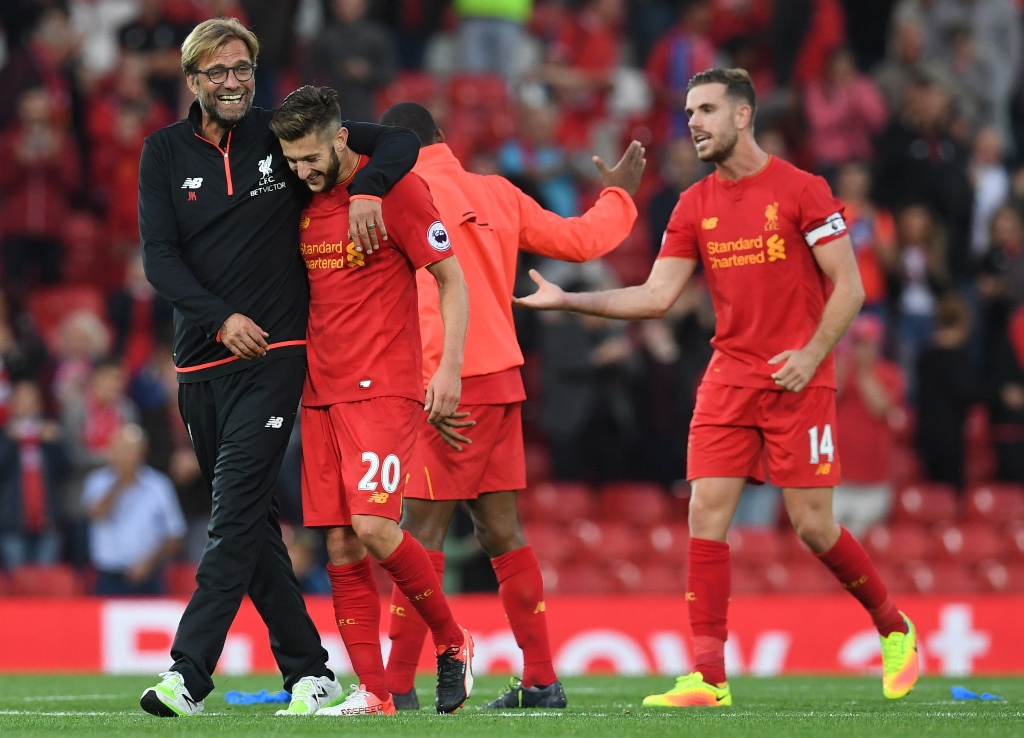 jurgen klopp l celebrates on the pitch at anfield in liverpool england on september 10 2016 photo afp