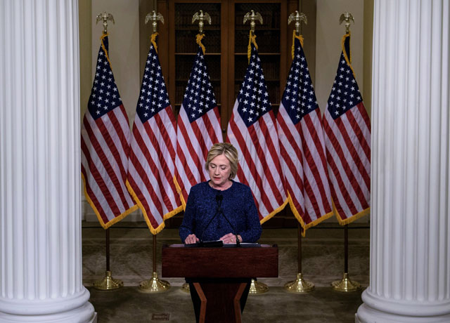 this file photo taken on september 9 2016 shows us democratic presidential nominee hillary clinton pausing while speaking to the press after a working session with national security advisers and experts at the new york historical society in new york photo afp