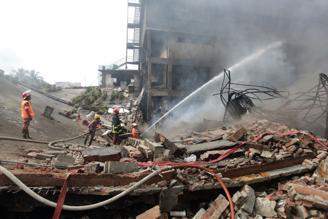 bangladeshi firefighters try to extinguish a fire that break out from an explosion in a factory in the key bangladeshi garment manufacturing town of tongi just north of the capital dhaka on september 11 2016 photo afp