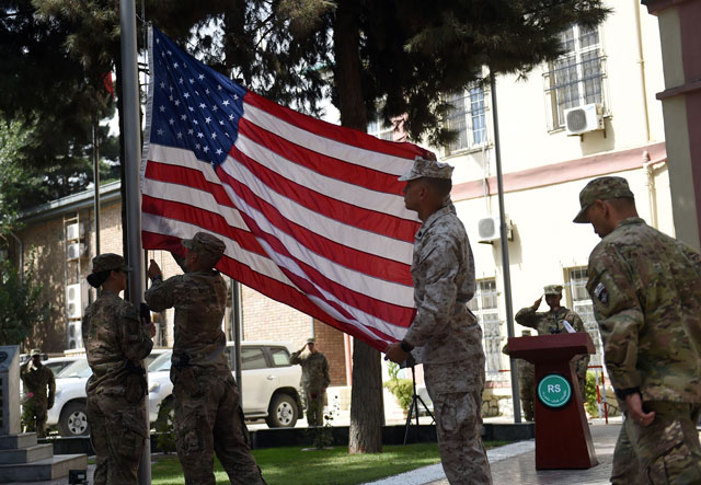 us military personnel fold a flag as they take part in a memorial ceremony in honour of the 15th anniversary of the september 11 2001 attacks on new york and washington dc at the international security assistance force isaf headquarters in kabul on september 11 2016 photo afp