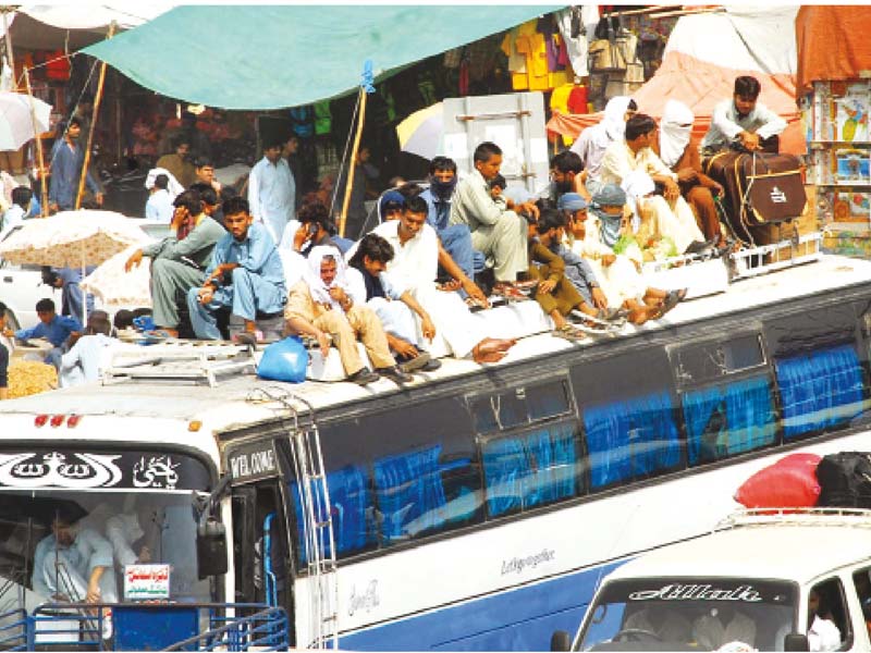 passengers travelling on rooftop of a bus photo online