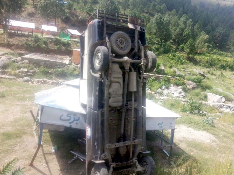 the damaged police van at the site photo express