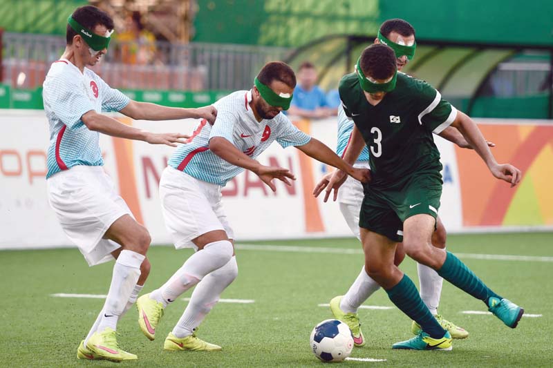 to even things all the players wear eye shades so that none can see anything it s the sound of the ball which contains bells that they follow as if seeing via their ears photo afp