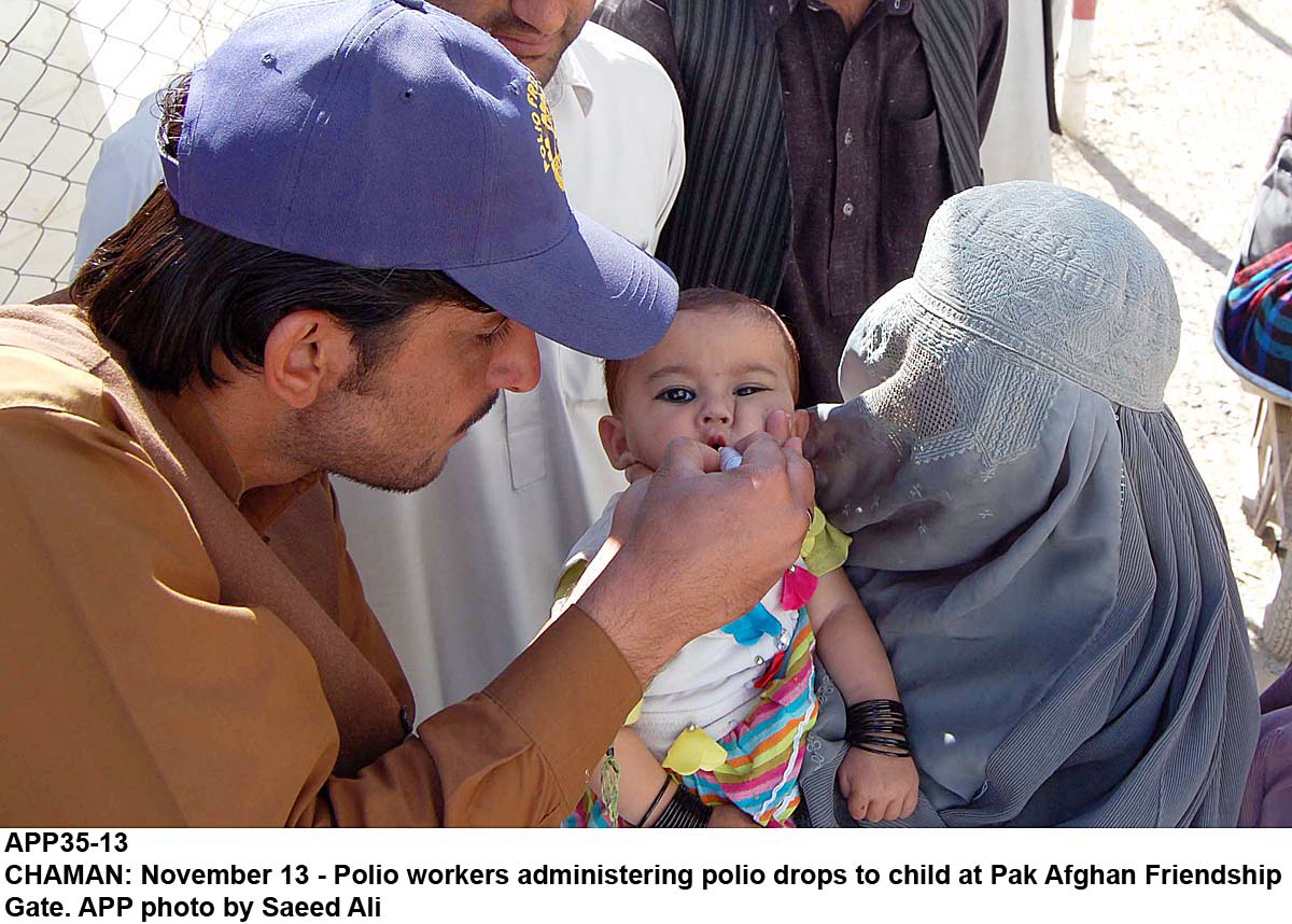 a file photo of a helath worker vaccinating a child photo app