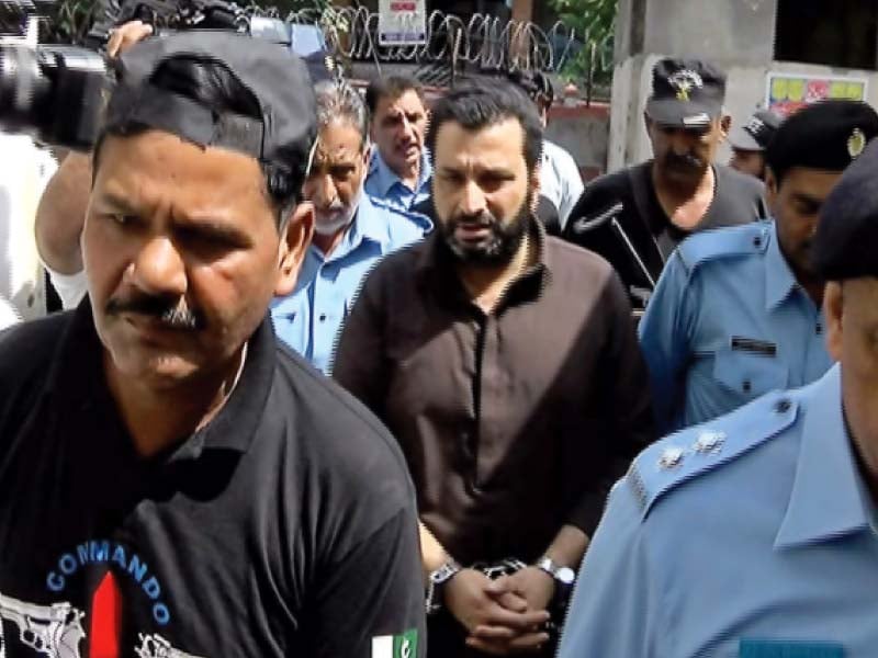 an extension in the physical custody remand of raja arshad mehmood to police for three more days in the barrister fahad malik murder case photo waseem nazir express