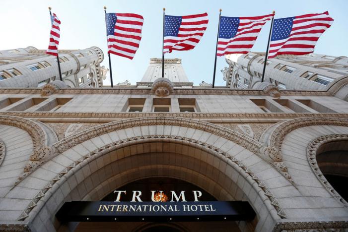 flags fly above the entrance to the new trump international hotel on it 039 s opening day in washington september 12 2016 photo reuters