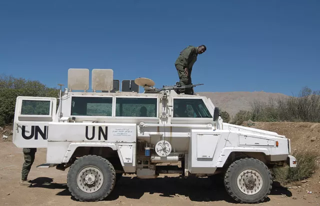 a peacekeeper of the united nations disengagement observer force undof stands on a vehicle as he monitors the border with syria near the village of majdal shams in the israeli occupied sector of the golan heights on september 13 2016 photo afp a peacekeeper of the united nations disengagement observer force undof stands on a vehicle as he monitors the border with syria near the village of majdal shams in the israeli occupied sector of the golan heights on september 13 2016 photo afp