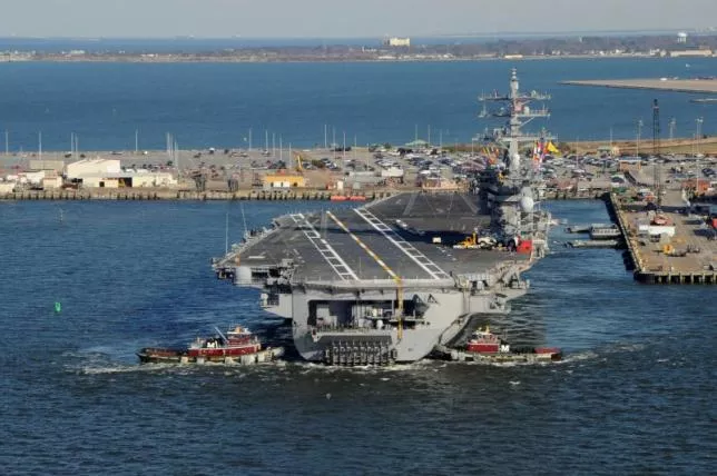 tug boats assist the nimitz class aircraft carrier uss dwight d eisenhower cvn 69 as it pulls away from the pier at naval station norfolk virginia in this handout photograph taken on february 21 2013 and released on february 22 photo reuters tug boats assist the nimitz class aircraft carrier uss dwight d eisenhower cvn 69 as it pulls away from the pier at naval station norfolk virginia in this handout photograph taken on february 21 2013 and released on february 22 photo reuters