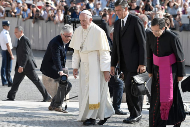 pope francis arrives at saint peter square to lead his weekly general audience on september 14 2016 in the vatican photo afp