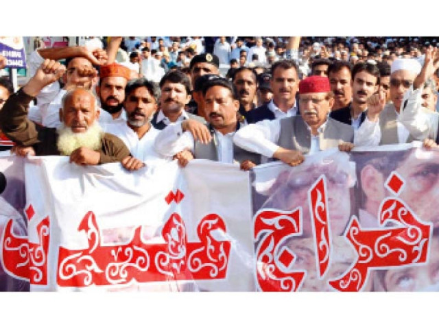 the ajk prime minister leading protesters during the march photo express the ajk prime minister leading protesters during the march photo express