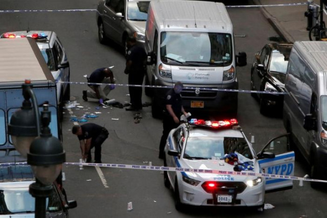 police investigate the scene where a man was shot by police in manhattan new york u s september 15 2016 photo reuters police investigate the scene where a man was shot by police in manhattan new york u s september 15 2016 photo reuters