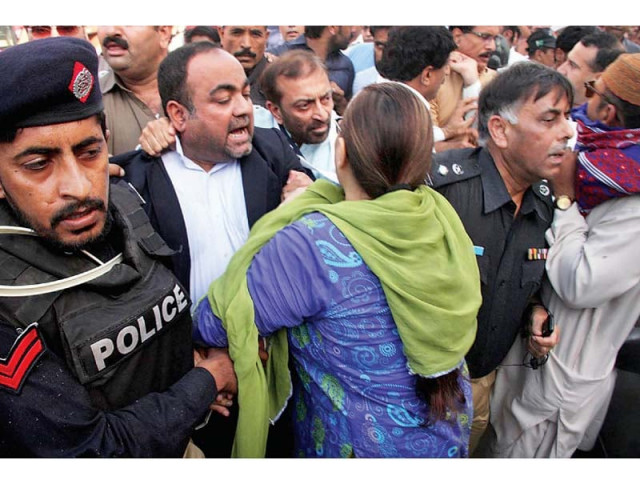 ssp rao anwar drags khawaja izhar towards the police vehicle after arresting him photo online ssp rao anwar drags khawaja izhar towards the police vehicle after arresting him photo online