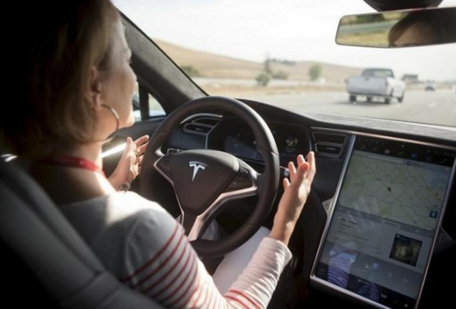 new autopilot features are demonstrated in a tesla model s during a tesla event in palo alto california photo reuters new autopilot features are demonstrated in a tesla model s during a tesla event in palo alto california photo reuters