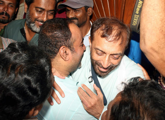 mqm leader farooq sattar receives khuwaja izharul hassan following his release photo express