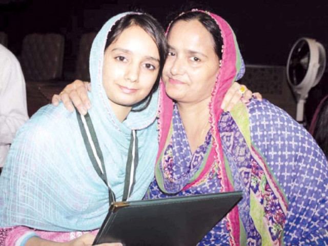 a position holder and her mother pose for the camera photo express a position holder and her mother pose for the camera photo express