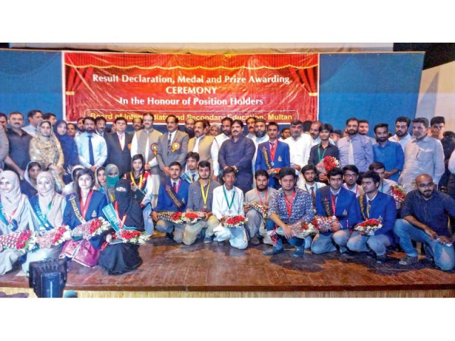 group photo of position holder students at a ceremony held at multan board photo express